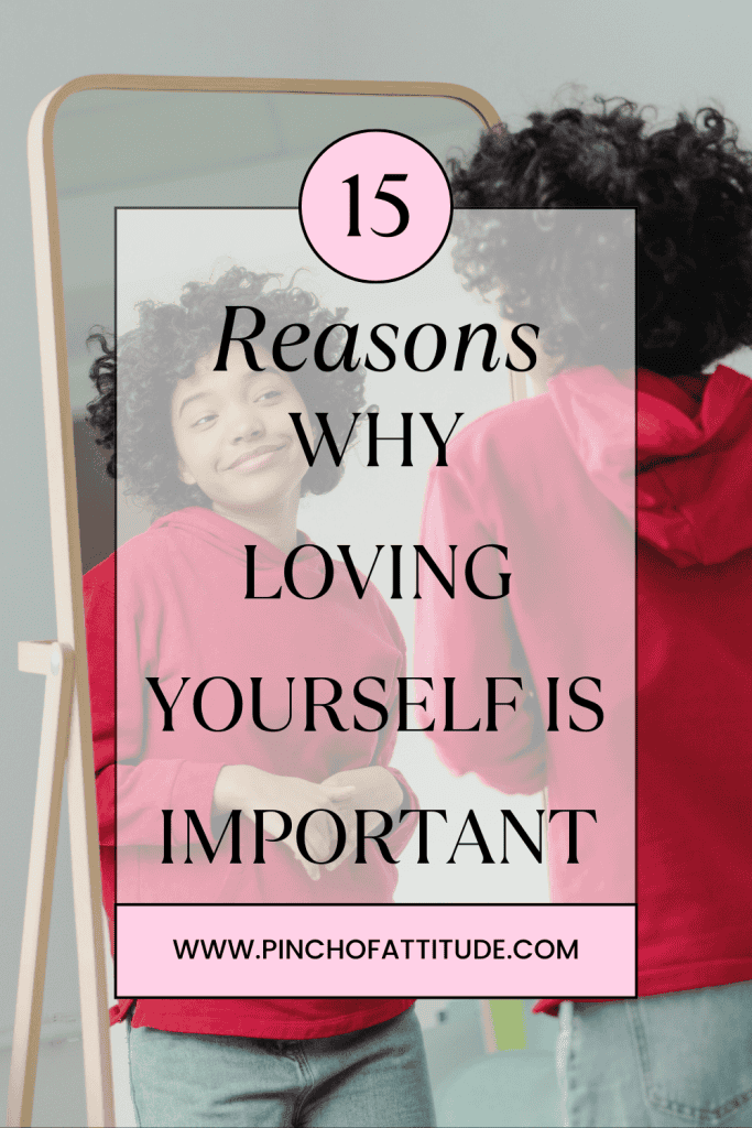 Pinterest - Pin with title "15 Reasons Why Loving Yourself is Important" showing a young curly-haired woman in a red hoodie and light denim jeans smiling confidently at herself in the mirror.