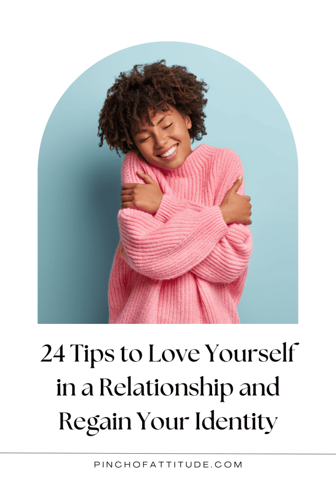 Pinterest - Pin with title "24 Tips to Love Yourself in a Relationship and Regain Your Identity" showing a curly-haired woman in a pink wool sweater hugging herself with her eyes closed while smiling.