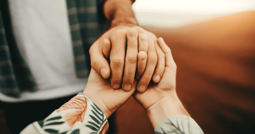 image showing woman and man hands holding on to each other.