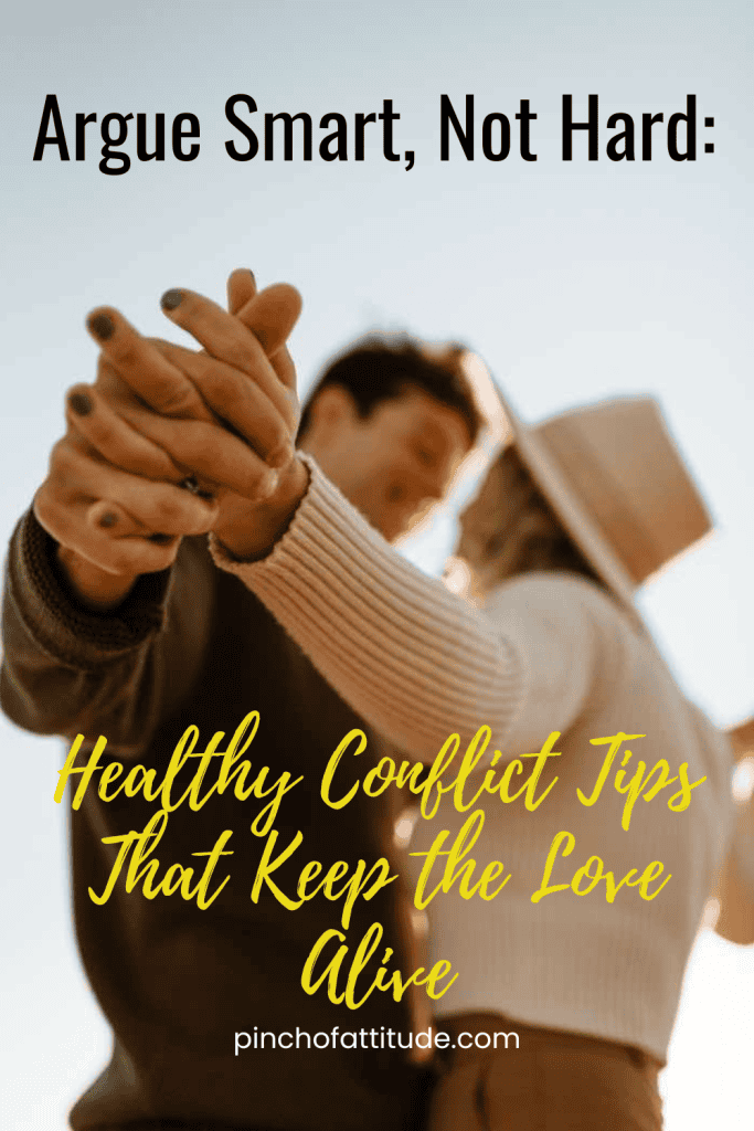 Pinterest - Pin with title "Argue Smart, Not Hard: Healthy Conflict Tips That Keep the Love Alive" showing a couple holding hands closely in focus with blurred faces in the background.