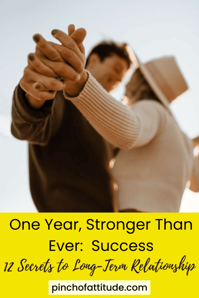 Pinterest - Pin with title "One Year, Stronger Than Ever: Success - 12 Secrets to Long-Term Relationship" showing a blurred image of a couple holding hands outdoors with soft lighting.