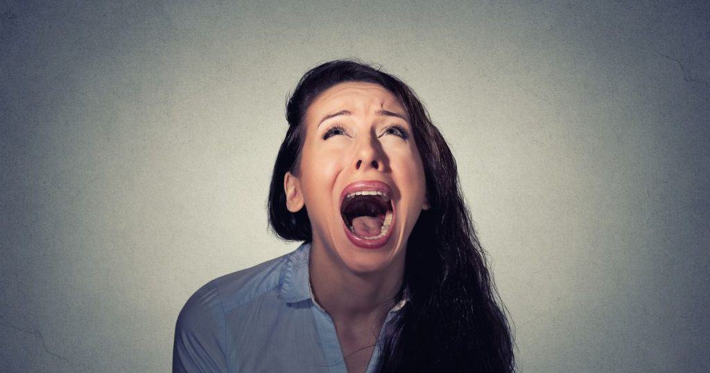 Woman screaming looking up