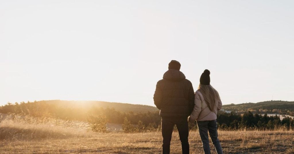 Valentines Date Ideas, couple hiking at sunrise.