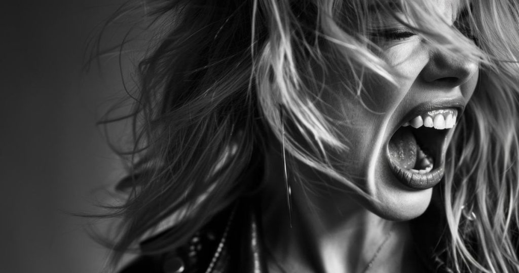 a black and white picture of a woman unhappy and screaming.