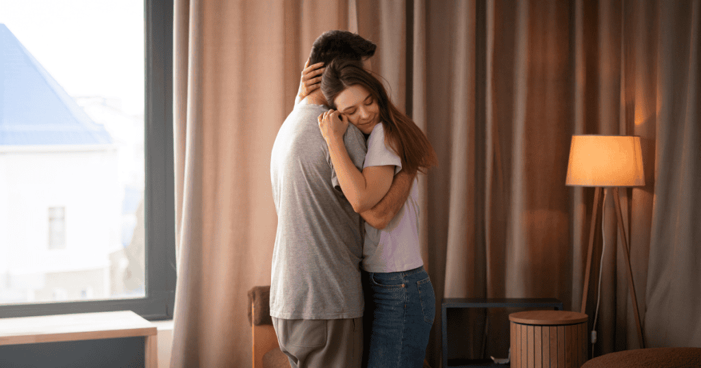 A woman hugs a man tightly with a hopeful smile, capturing the emotional pull of the hope trap that keeps many partners tied to a narcissist.