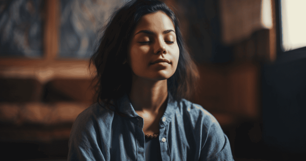 A young woman sits peacefully with her eyes closed in quiet reflection, symbolizing the hidden power of letting go.