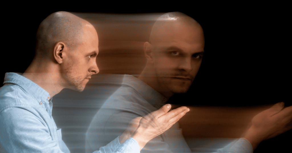 A man is shown in motion with a blurred duplicate of himself, symbolizing the hidden manipulation and shifting tactics that reveal the narcissist’s real goal.