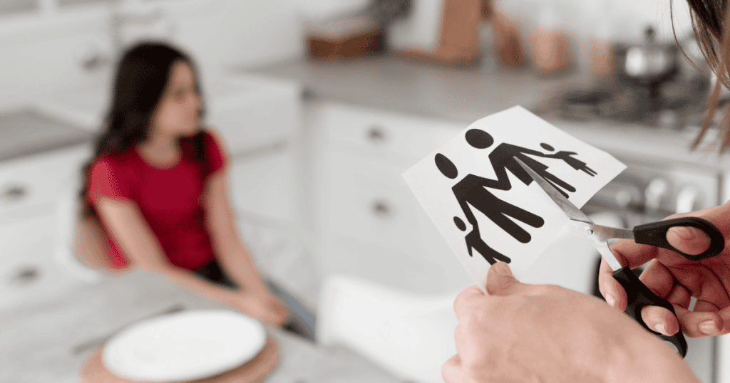 A symbolic image of someone cutting a family figure while a child looks on, representing why families close ranks around the abuser, often sacrificing truth and the vulnerable to maintain appearances.