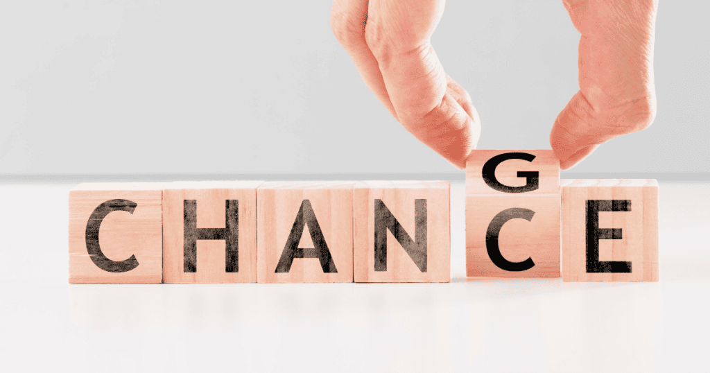 Wooden blocks spell the word “CHANGE” with one block shifting to form “CHANCE,” symbolizing why nothing you do will make narcissists stop because the change isn’t in your control.
