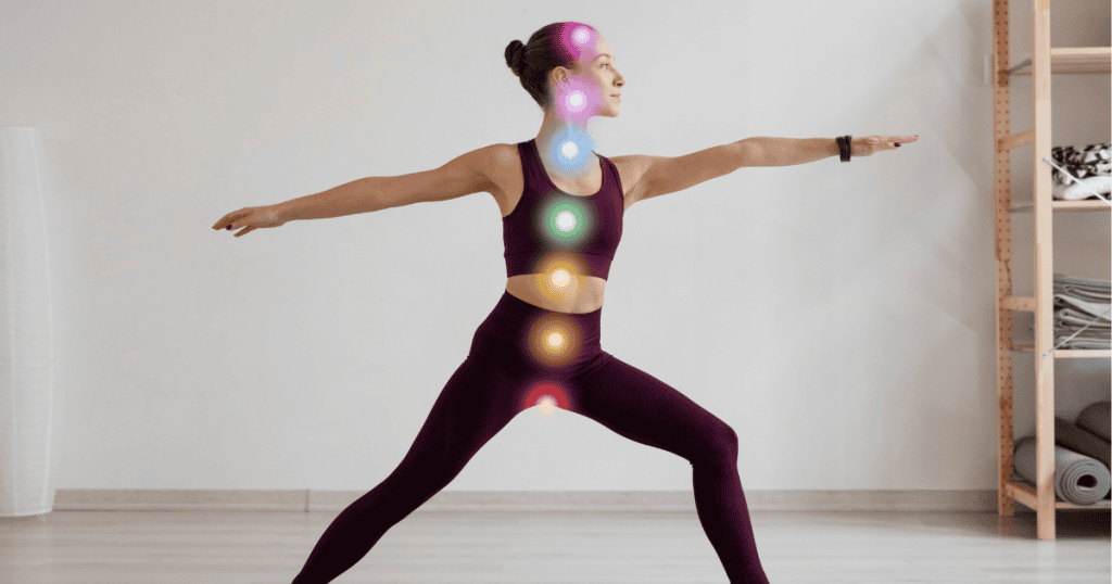 A woman holds a warrior yoga pose with colorful lights marking her energy centers, showing a focused effort to integrate physical discipline and energetic renewal.