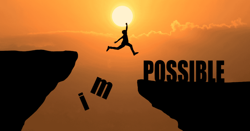 A silhouette of a person leaps between cliffs as falling letters change “impossible” to “possible,” representing breaking free from FOG.