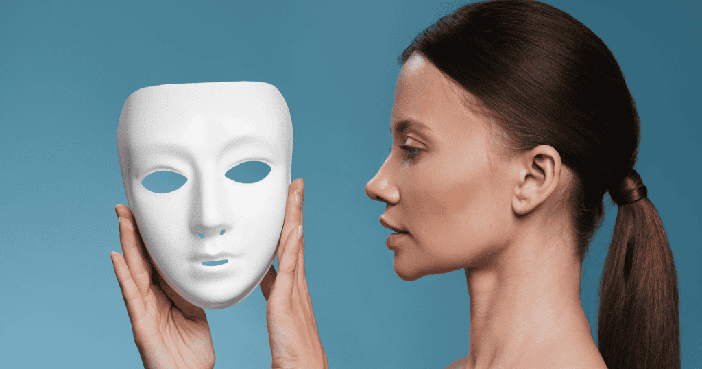 A woman faces a plain white mask against a blue background, representing the concept of unmasking the narcissist.