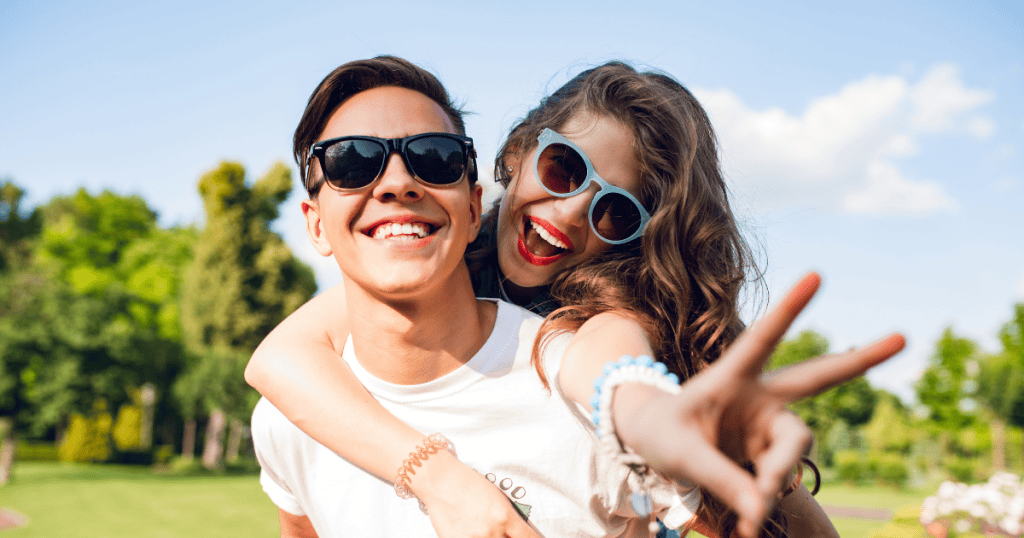 A smiling couple enjoys a playful moment outdoors, symbolizing the freedom and joy that come from breaking free of the chains a narcissist once called love.