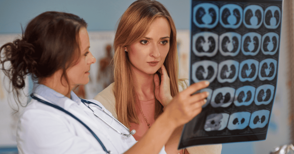 A doctor shows a concerned woman medical brain scans, emphasizing why brain health matters after narcissistic abuse.