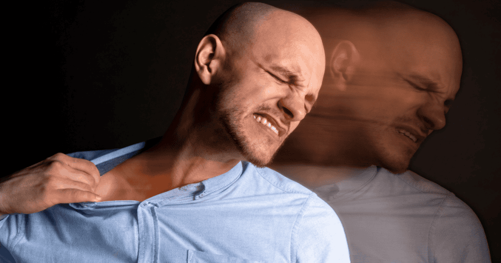 A man clutches his chest in a dark, motion-blurred setting, visualizing the internal instability of losing external control.