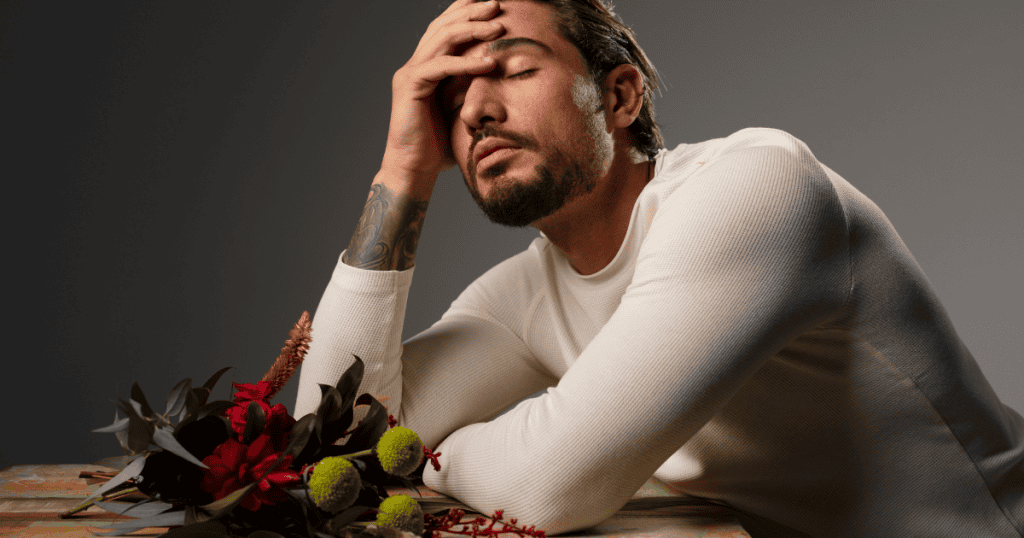 A man leans his head into his hand in apparent defeat, capturing the exhaustion of realizing his influence has finally faded.