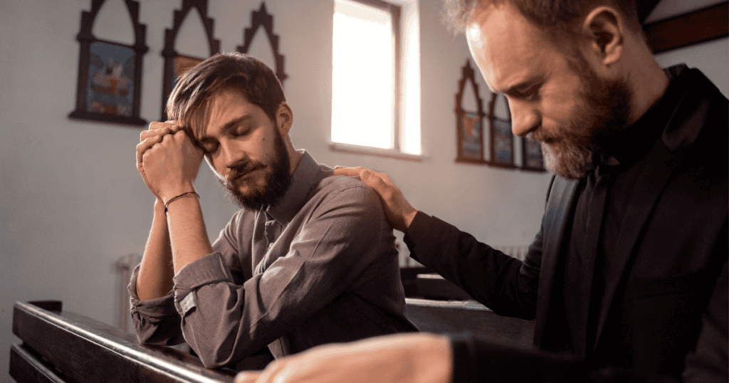 A man clasps his hands in prayer within a quiet church pew, his over-the-top expression of anguish threatening to disrupt the sanctuary's intended calm.