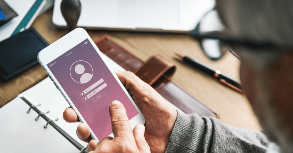 A person using a smartphone to log into an anonymous account, illustrating how narcissists secretly create fake online profiles to control narratives and spy on others.