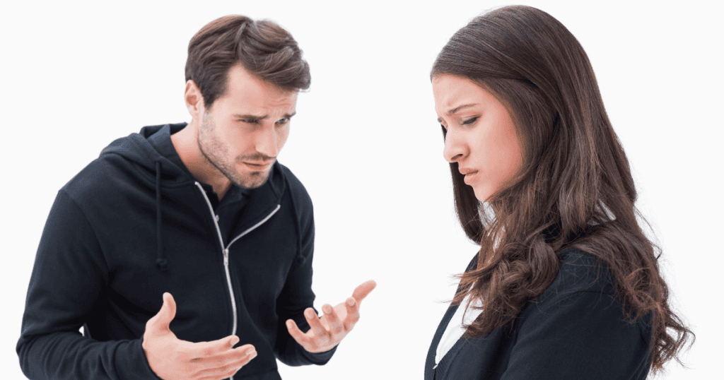A man gestures broadly while looking down at a somber woman, depicting a lopsided exchange where one's inner reality is cast onto the other.