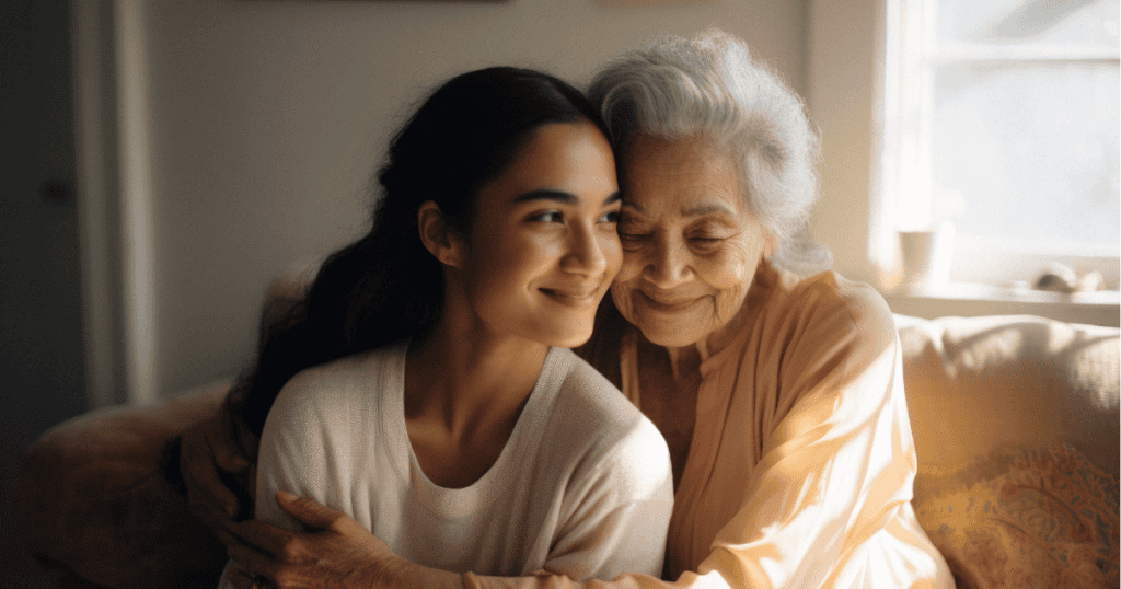 A young woman and an elderly woman share a warm, glowing embrace, capturing the initial stage of establishing a deep emotional connection.
