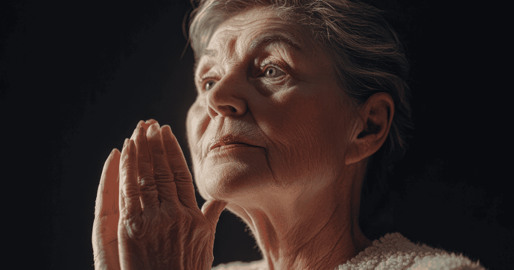 An elderly woman looks upward with her hands clasped in prayer, suggesting a moment of deep, performative soul-searching.