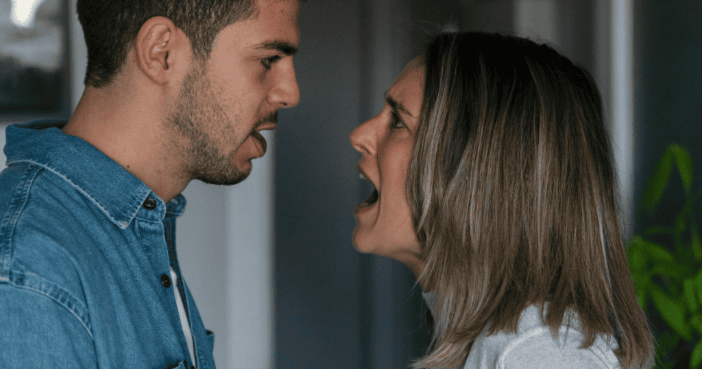A man and a woman are caught in a heated face-to-face shout, showcasing a peak of verbal friction that masks the original point.