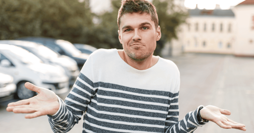 A man shrugging with a smug, unbothered expression, representing the dismissive indifference a narcissist shows until you start speaking the only languages that actually get through to them.
